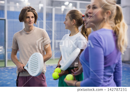Portrait of four tennis players discussing topical issues Portrait of four tennis players discussing topical issues 142787231