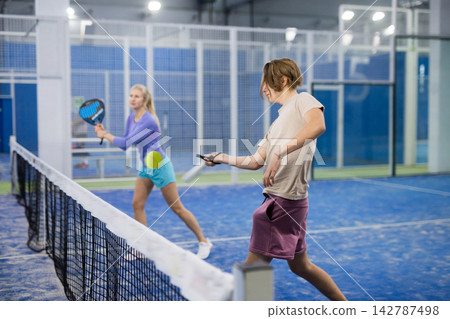 Portrait of a guy tennis player playing padel Portrait of a guy tennis player playing padel 142787498