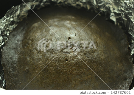 brown chocolate cake bake on aluminum foil paper brown chocolate cake bake on aluminum foil paper 142787601