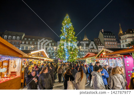 A giant Christmas tree and lively atmosphere at the Christmas market in Place Kléber, Strasbourg, France A giant Christmas tree and lively atmosphere at the Christmas market in Place Kléber, Strasbourg, France 142787977
