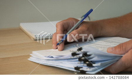 Businessman signing official contract at desk Businessman signing official contract at desk 142788084