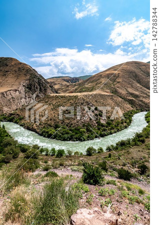 Chu River winding through a dramatic mountain canyon Kyrgyzstan Chu River winding through a dramatic mountain canyon Kyrgyzstan 142788344