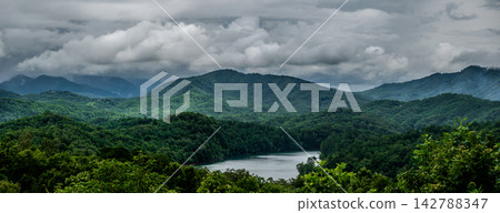 Lake Fontana and rolling mountain ridges under a heavy stormy sky North Carolina 142788347