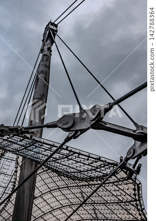 Tensile structure cable network and mast connection detail at Munich Olympic Park Germany Tensile structure cable network and mast connection detail at Munich Olympic Park Germany 142788364