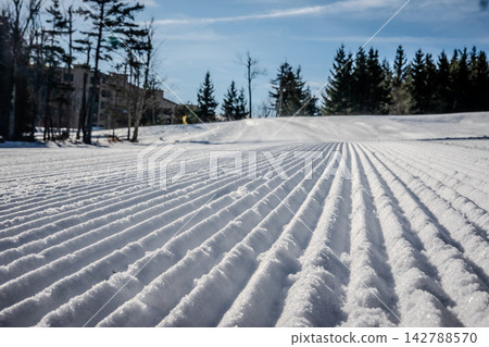 Freshly Groomed Snow at Snowshoe West Virginia Ski Resort with Corduroy Texture and Sunny Winter Mountain Conditions Freshly Groomed Snow at Snowshoe West Virginia Ski Resort with Corduroy Texture and Sunny Winter Mountain Conditions 142788570