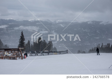 Breckenridge Ski Resort Colorado Snow Covered Terrain Park and Mountain Lodge Buildings in Winter Snowfall with Overcast Conditions Breckenridge Ski Resort Colorado Snow Covered Terrain Park and Mountain Lodge Buildings in Winter Snowfall with Overcast Conditions 142788578