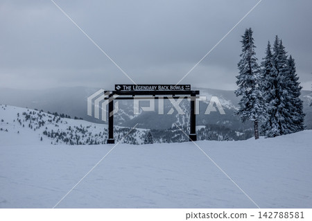 Vail Legendary Back Bowls Sign in Colorado with Snow Covered Mountain Landscape and Low Visibility Winter Conditions Vail Legendary Back Bowls Sign in Colorado with Snow Covered Mountain Landscape and Low Visibility Winter Conditions 142788581