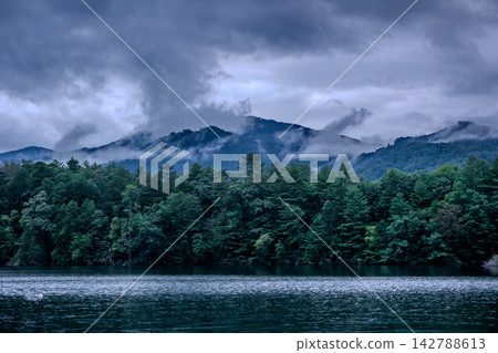 Moody clouds over Lake Santeetlah and mountain dock North Carolina Moody clouds over Lake Santeetlah and mountain dock North Carolina 142788613