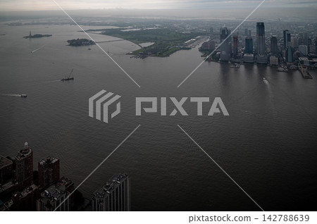 New York City, New York, USA - MAY 2025: Aerial skyline and harbor views from One World Trade Center observation deck in Manhattan New York City, New York, USA - MAY 2025: Aerial skyline and harbor views from One World Trade Center observation deck in Manhattan 142788639