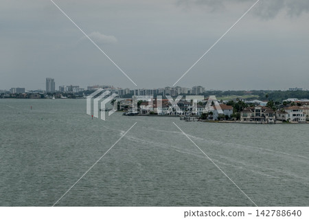 Clearwater Florida Intracoastal Waterway with Waterfront Homes and Distant Coastal Skyline Under Overcast Sky Clearwater Florida Intracoastal Waterway with Waterfront Homes and Distant Coastal Skyline Under Overcast Sky 142788640