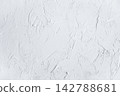 A background resembling a white plaster wall. 142788681