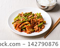 Stir fried asparagus with kimchi cabbage and pork eating with cooked rice, Korean style 142790876