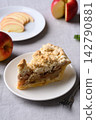 Apple crumble pie slice on white plate and fresh apple fruit 142790881