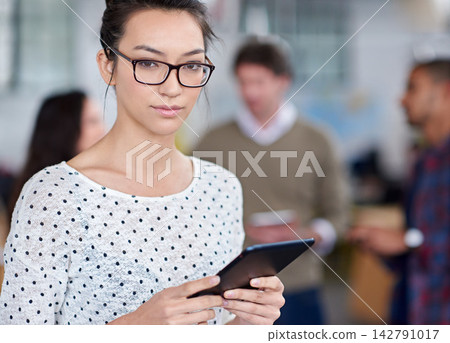 Woman, tablet and serious in office working for agency, coworking workplace and online or startup business website. Review, planning and social networking and job, browse and company information 142791017