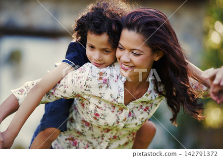Piggy back, outdoor and mother with boy, smile and bonding together with happiness, relax and playful. Family, single parent and mama with son in garden, fun and cheerful with love, nature and break Piggy back, outdoor and mother with boy, smile and bonding together with happiness, relax and playful. Family, single parent and mama with son in garden, fun and cheerful with love, nature and break 142791372