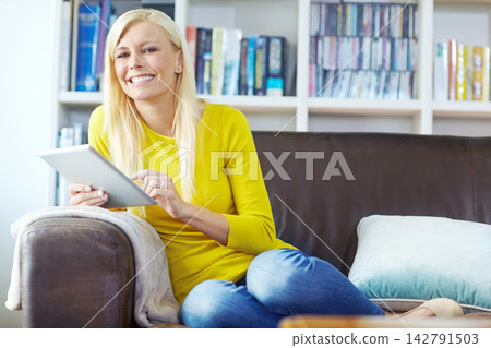 Woman, portrait and happy on sofa with tablet for internet surfing, online search or social media in lounge of home. Person, smile and digital tech for reading ebook, web games and browsing on couch Woman, portrait and happy on sofa with tablet for internet surfing, online search or social media in lounge of home. Person, smile and digital tech for reading ebook, web games and browsing on couch 142791503