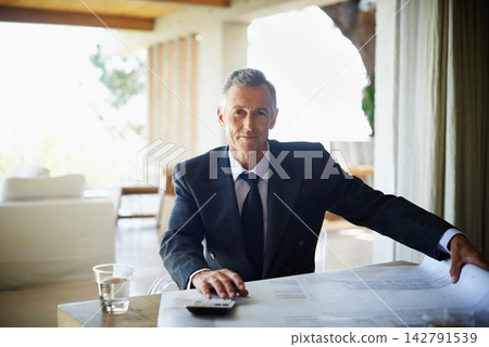 Portrait, blueprint and mature man in office, smile and calculator for tax of investment in property. Real estate, realtor and executive of business with floor plan and paperwork for budget on desk Portrait, blueprint and mature man in office, smile and calculator for tax of investment in property. Real estate, realtor and executive of business with floor plan and paperwork for budget on desk 142791539