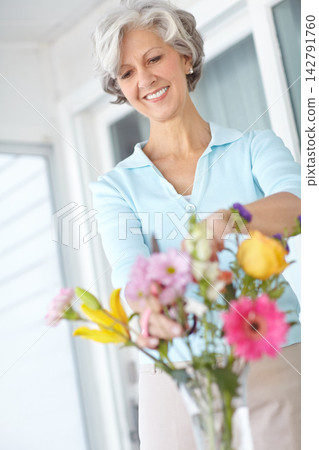 Happy, senior and woman arrange flowers in home, vase and creativity in spring of retirement. Floral, bouquet and elderly person with gardening hobby or relax with daisy wildflowers in house Happy, senior and woman arrange flowers in home, vase and creativity in spring of retirement. Floral, bouquet and elderly person with gardening hobby or relax with daisy wildflowers in house 142791760