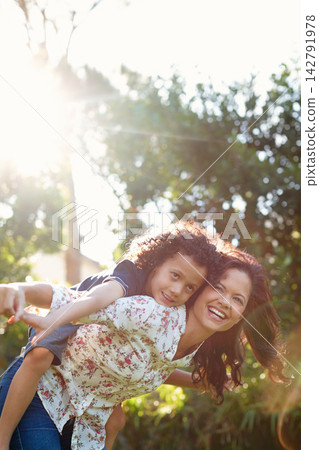 Mother, son and laughing in park for fun in summer with child development in sunshine for happiness. Bonding, weekend and nature with lens flare, backyard and childhood with love or funny in Canada. 142791978