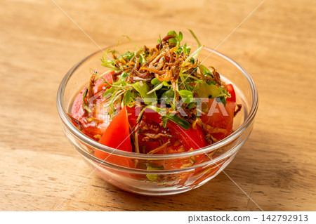 Crispy dried sardine and tomato salad, a refreshing Japanese style Crispy dried sardine and tomato salad, a refreshing Japanese style 142792913