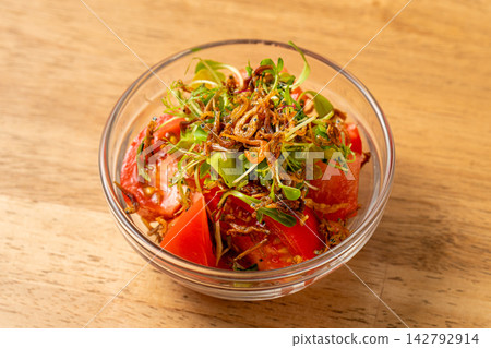 Crispy dried sardine and tomato salad, a refreshing Japanese style Crispy dried sardine and tomato salad, a refreshing Japanese style 142792914