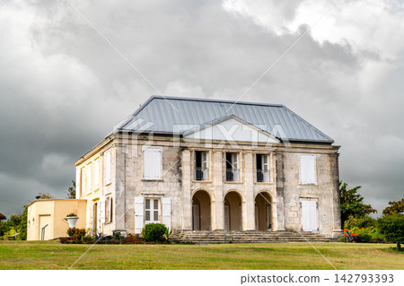 Historic Habitation Murat colonial plantation mansion under an overcast sky in Marie-Galante, Guadeloupe. Historic Habitation Murat colonial plantation mansion under an overcast sky in Marie-Galante, Guadeloupe. 142793393