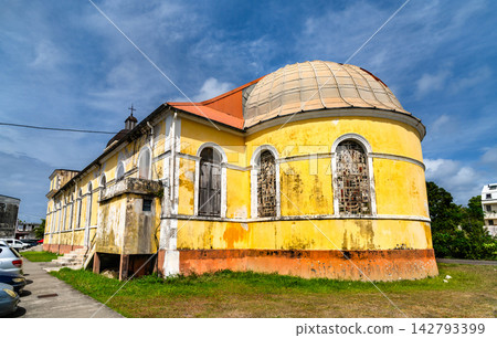 The exterior of the historic Catholic Church of the Immaculate Conception of Grand-Bourg with yellow facade in Marie-Galante, Guadeloupe, Caribbean France The exterior of the historic Catholic Church of the Immaculate Conception of Grand-Bourg with yellow facade in Marie-Galante, Guadeloupe, Caribbean France 142793399