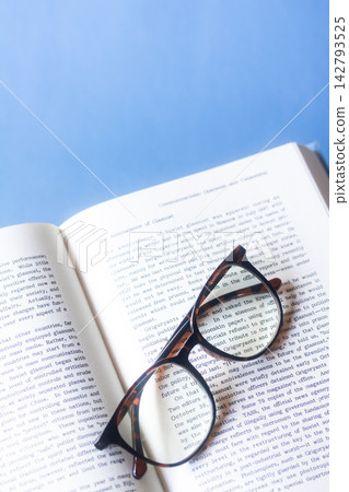 Reading - foreign books and magnifying glasses that make the text appear larger. Reading - foreign books and magnifying glasses that make the text appear larger. 142793525