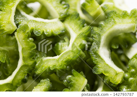 Close-up of a bitter melon after the seeds have been removed and it has been cut. Close-up of a bitter melon after the seeds have been removed and it has been cut. 142793787