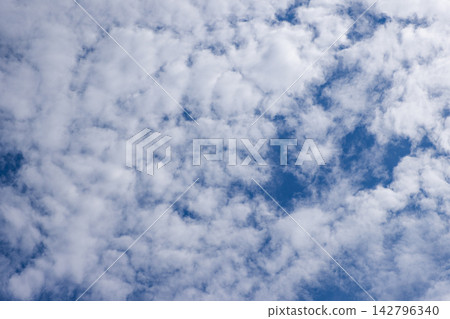 Bright blue sky with fluffy white clouds. Bright blue sky with fluffy white clouds. 142796340