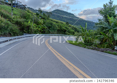 Winding downhill road at Thailand, photographed from the driver's perspective while driving. Winding downhill road at Thailand, photographed from the driver's perspective while driving. 142796346