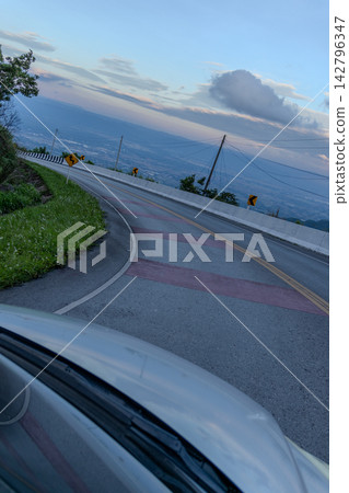 Winding downhill road at Thailand, photographed from the driver's perspective while driving. Winding downhill road at Thailand, photographed from the driver's perspective while driving. 142796347