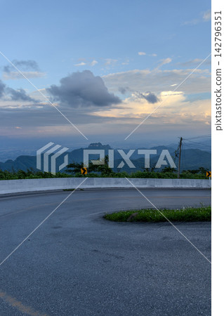 Winding downhill road at Thailand, photographed from the driver's perspective while driving. Winding downhill road at Thailand, photographed from the driver's perspective while driving. 142796351