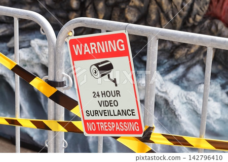 English warning sign indicating 24-hour security camera surveillance. English warning sign indicating 24-hour security camera surveillance. 142796410