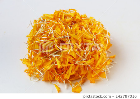 Yellow marigold petals on white background. Yellow marigold petals on white background. 142797016