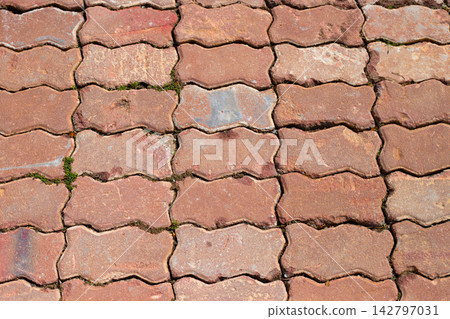 Red concrete paving blocks texture background top view Red concrete paving blocks texture background top view 142797031