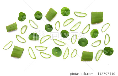Fresh aloe vera slices and gotu kola leaves on a white background. Fresh aloe vera slices and gotu kola leaves on a white background. 142797140