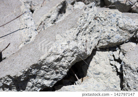 Broken concrete rubble and rebar debris close up Broken concrete rubble and rebar debris close up 142797147