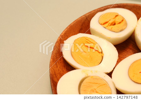 Boiled chicken egg whites cut in half with yolks Boiled chicken egg whites cut in half with yolks 142797148