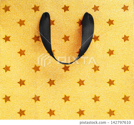 Yellow and black shopping background with bag handles and copy space for Black Friday sale discounts promotions and advertising Yellow and black shopping background with bag handles and copy space for Black Friday sale discounts promotions and advertising 142797610