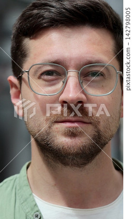 Vertical video. Portrait of a man using a smartphone for messaging and social networking. Vertical video. Portrait of a man using a smartphone for messaging and social networking. 142798005