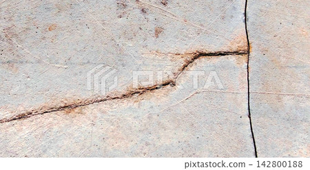 Weathered concrete surface with structural cracks and rust stains. Weathered concrete surface with structural cracks and rust stains. 142800188