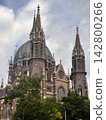 Gothic Brick Church with Tall Spires and Large Dome 142800266