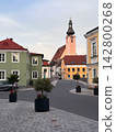 Quiet European Town Street with Historic Church Tower 142800268