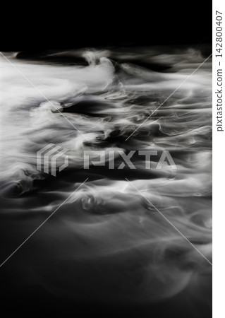 Dry ice smoke and fog spread across a black background. Dry ice smoke and fog spread across a black background. 142800407