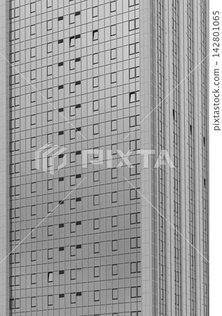 Monochrome high rise building facade with repeating windows. Abstract urban architecture with vertical lines and geometric pattern. Ideal for real Monochrome high rise building facade with repeating windows. Abstract urban architecture with vertical lines and geometric pattern. Ideal for real 142801065
