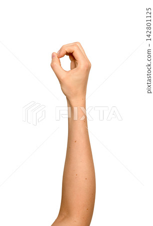 Right hand forming an oval shape as if holding something. Woman s arm raised gripping an invisible Right hand forming an oval shape as if holding something. Woman s arm raised gripping an invisible 142801125