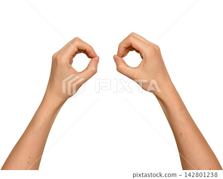 Two hands forming circular shapes like binoculars. Woman s arms raised making round frames near each Two hands forming circular shapes like binoculars. Woman s arms raised making round frames near each 142801238