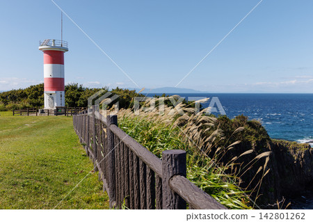 Takanozaki Lighthouse on the Tsugaru Peninsula, overlooking the blue sky and the Tsugaru Strait. Takanozaki Lighthouse on the Tsugaru Peninsula, overlooking the blue sky and the Tsugaru Strait. 142801262