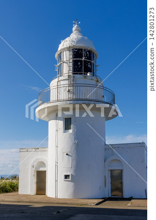 The white Tappi Cape Lighthouse overlooking the clear blue sky and the Tsugaru Strait. The white Tappi Cape Lighthouse overlooking the clear blue sky and the Tsugaru Strait. 142801273